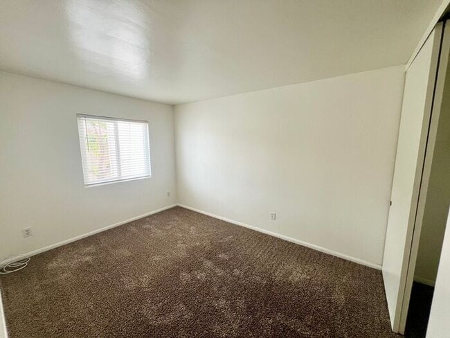 Building Photo - Stunning 4BR Townhome with Hardwood Floors, Private Patio, Community Pool & 2-Car Garage!