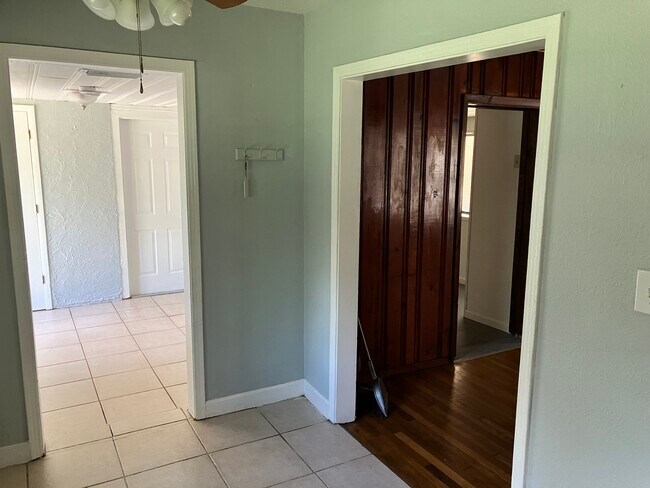 From kitchen into living room on the right and dining room on the left - 1331 S Summerlin Ave