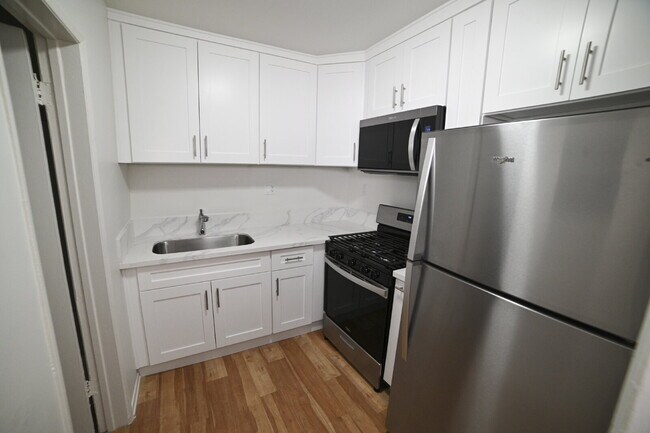 Building Photo - Newly remodeled studio in a gated building with pool and laundry room!