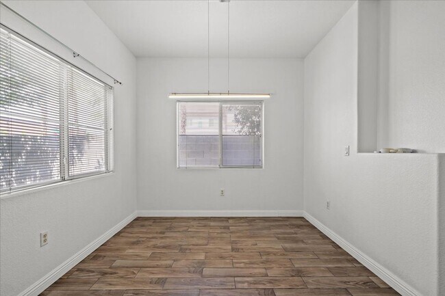 Building Photo - Charming 2-Bedroom First Floor Featuring Open Layout, Fireplace, Patio & Community Pool
