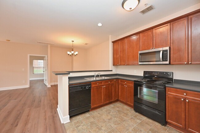 Building Photo - **PRISTINE GARDEN-LEVEL CONDO ON THE FIRST LEVEL NEAR PAVILION AND COMMUNITY GREEN SPACE**