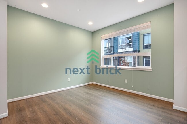 Building Photo - A Beautiful Corner Home Designed for Comfort, Light & Community!