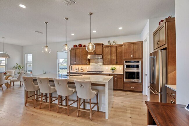 Building Photo - Resort-Style Furnished Lakefront Living in SilverLeaf | 100” Theater & Golf Cart Included