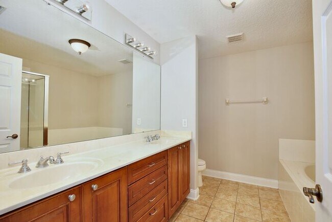 Building Photo - AGENT SHOWINGS ONLY! Stunning 3/2.5 Corner Unit Townhome with a Spacious 2 Car Garage in the Gate...