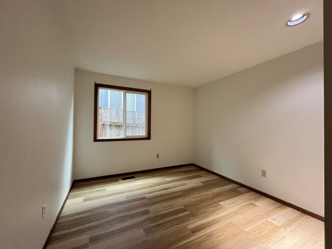 Building Photo - Spacious 3-Bedroom Home with Custom Stone Fireplace, Attached 2-Car Garage & Expansive Backyard i...