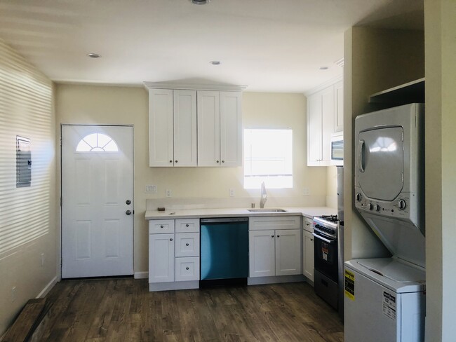 Kitchen with brand new appliances including: refrigerator, dishwasher, stove and oven, microwave - 7250 Capistrano Ave