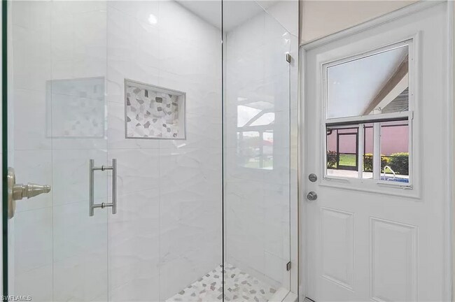 Bathroom 2 which goes out to pool - 117 SE 40th Ter