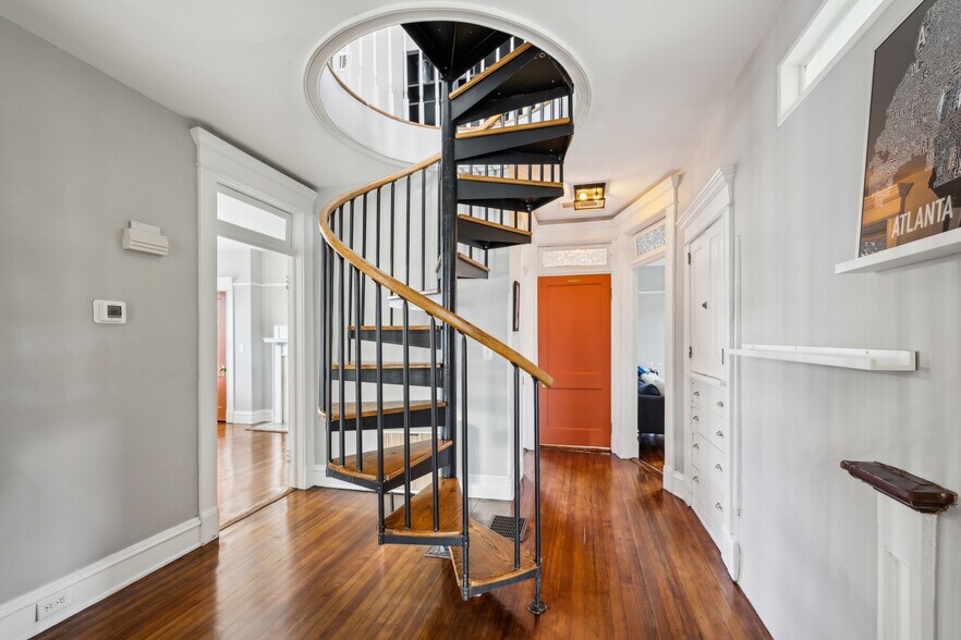 Spiral staircase up to the lofted 3rd floor space with bedroom, office area and en suite bathroom. - 1118 Colquitt Ave NE