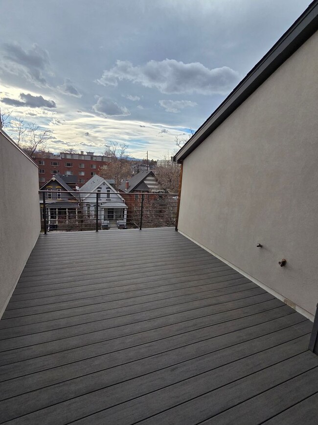 Building Photo - STUNNING 4-LEVEL TOWNHOME IN HIGHLANDS WITH SAUNA, 2-CAR GARAGE + AMAZING ROOFTOP DECK!