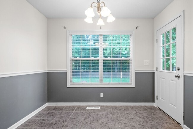 Building Photo - Pet Friendly Three Bedroom with Bonus!