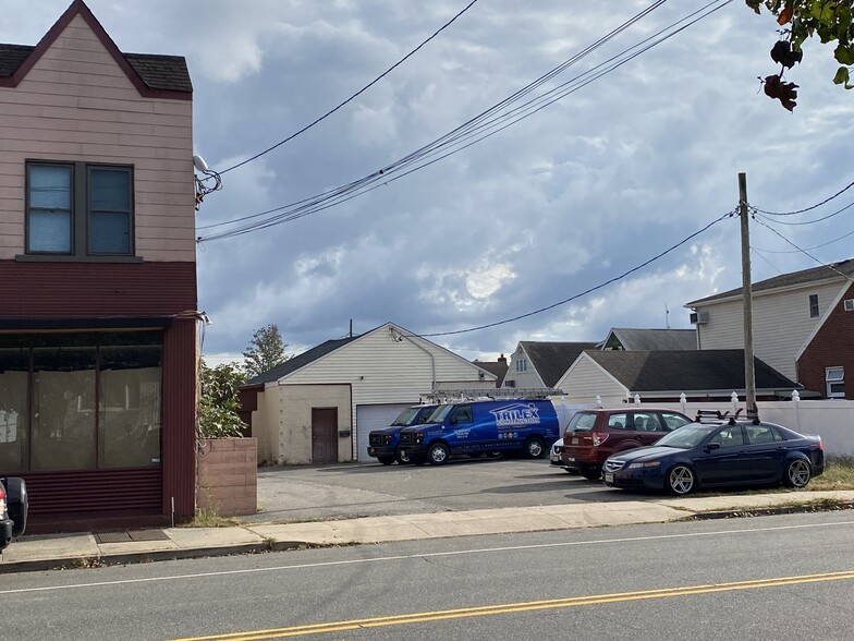 Private parking lot adjacent to building - 85 Westbury Ave