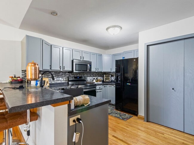 Building Photo - Spacious 3BR/3BA Condo with Finished Basement + 2-Car Garage — Available Now