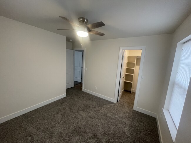 Bedroom 1 with walk in closet - 227 N El Paso St