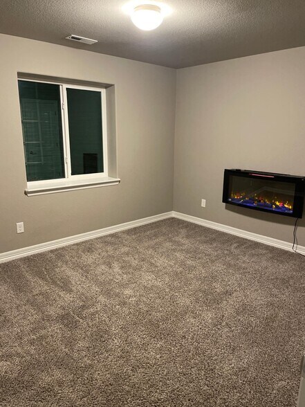 Second bedroom w/electric fireplace - 5383 Homeward Dr