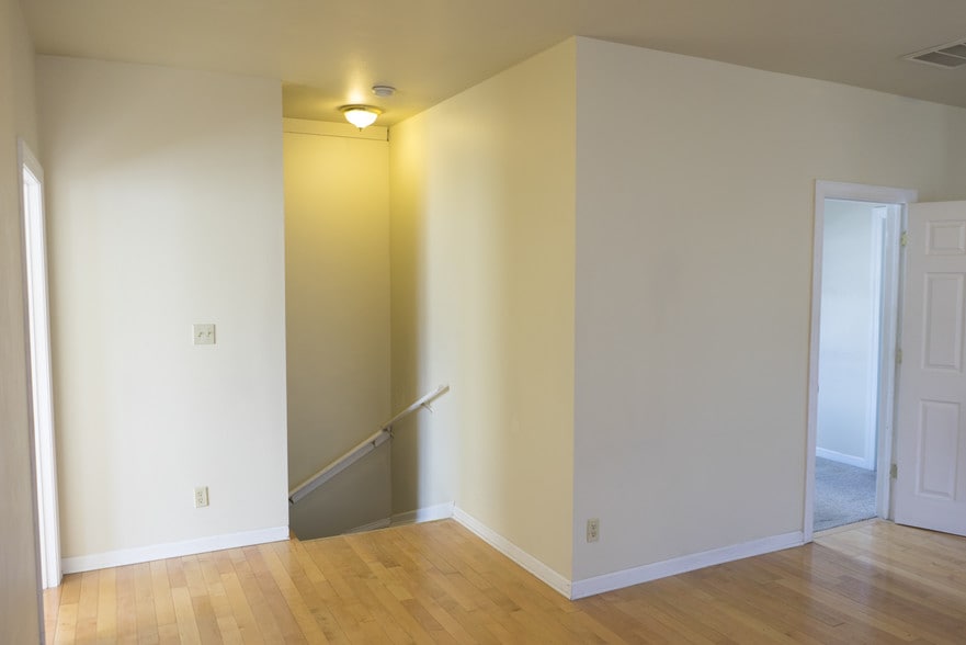 Stairway down to front door - 724 E Center St