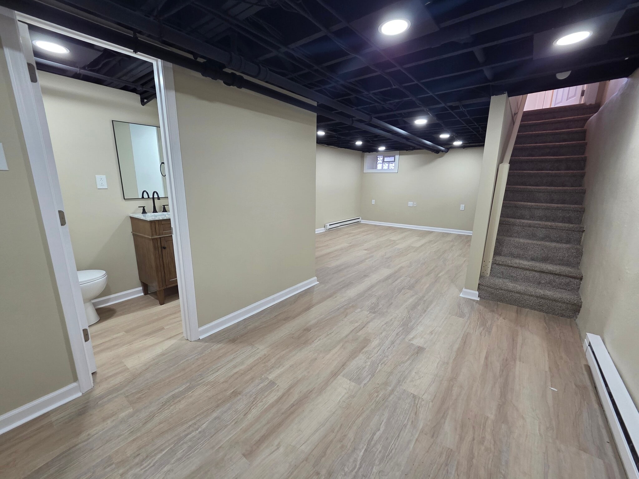 Basement with 3/4 bath and outside exit to deck - 2450 Mansfield Ave