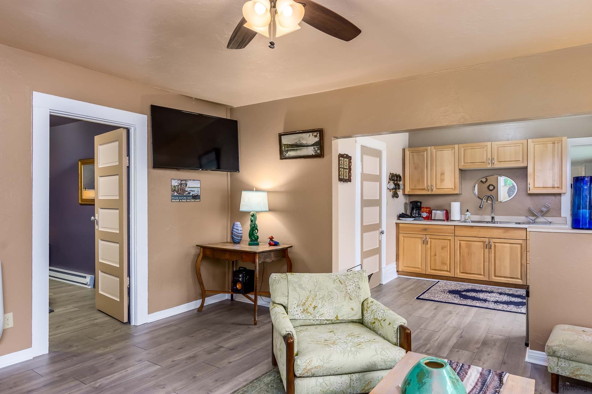 living room view toward kitchen and bedroom door (on the left) (staged) - 1124 Almaden St