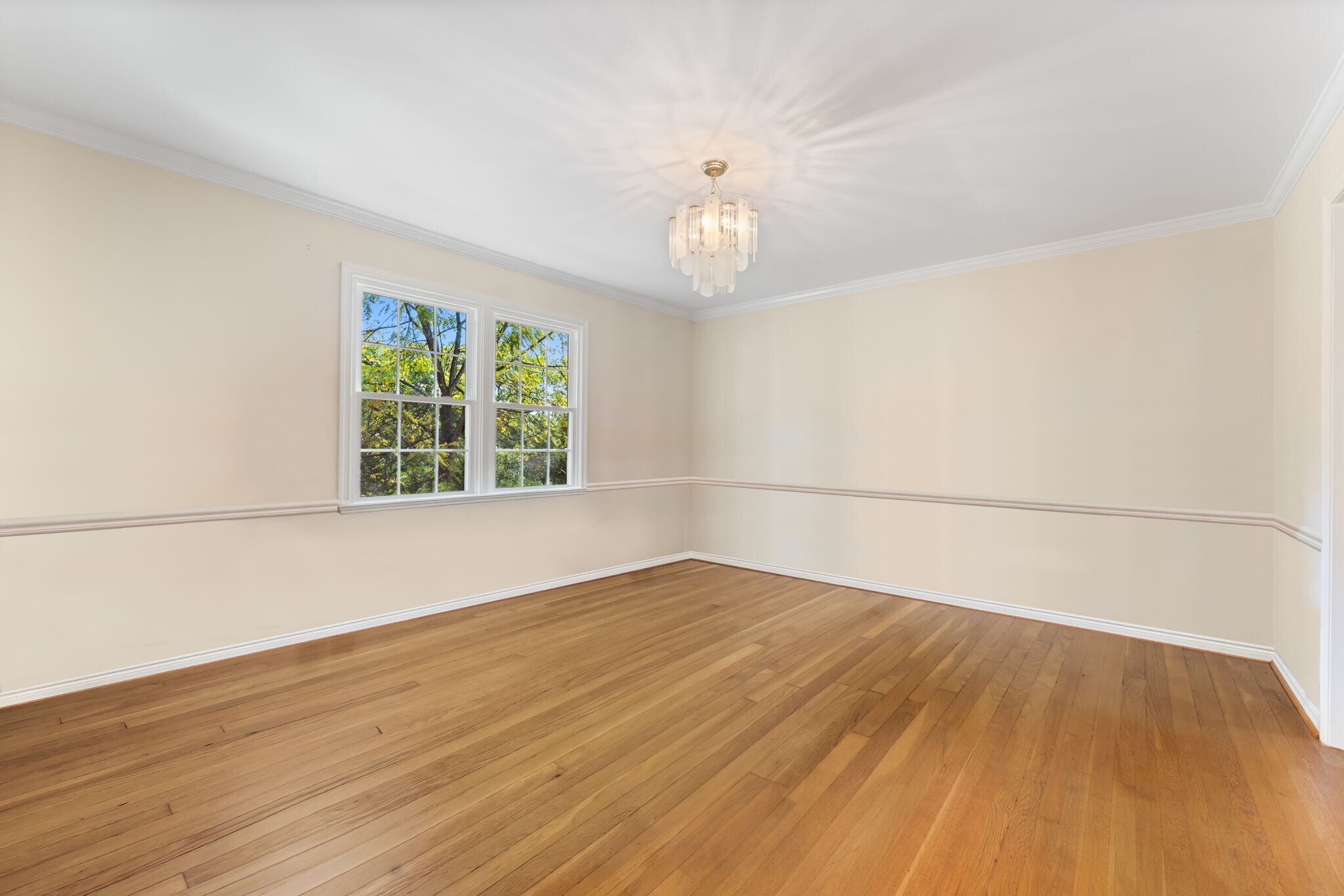 Hardwood floors and chandelier in oversized Dining Room - 9 Snug Hill Ct