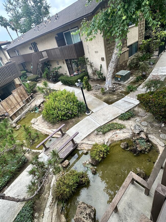 Building Photo - UPSTAIRS 1 BEDROOM CONDO FOR LEASE- GATED ...
