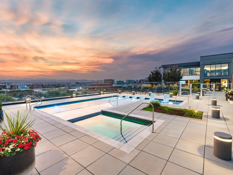Rooftop pool and spa with sunset views over the city and mountains. - Modera West Wash Park