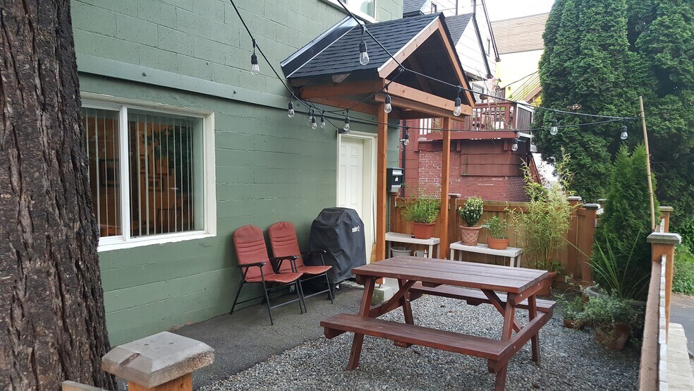 Fenced yard outside front entrance into unit. - 3822 Fremont Ave N