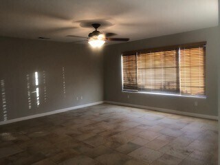 Building Photo - DESERT KNOLLS 3 BEDROOM HOME WITH LARGE RV GARAGE!