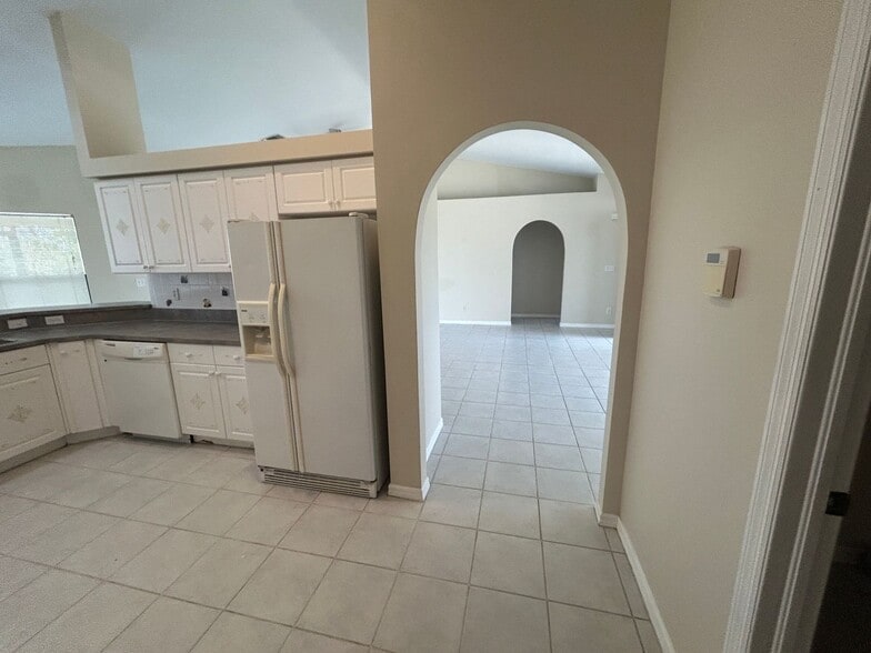 Building Photo - Freshly painted interior 2/2  spacious home on fresh water canal