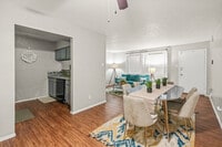 Spacious dining area with seamless flow into kitchen and living space. - Evria Terraces (NEW) Apartments