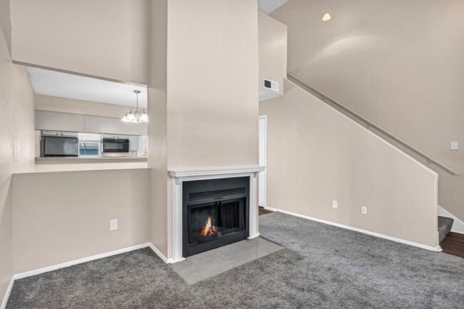 Spacious Living Room with Fireplace – Bright open layout with vaulted ceilings near Arlington - Three60 North Apartments