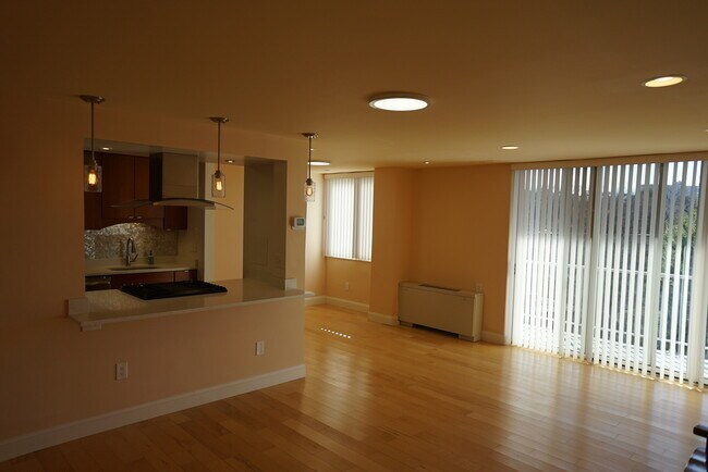 Spacious living room opens to separate dining or den area - 4520 King St