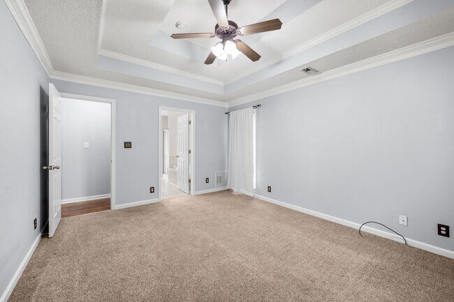 Building Photo - Stunning Stone Fireplace • Finished Basement • Fenced Yard