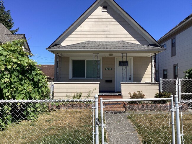 Building Photo - Charming 2BR Home with Spacious Yard, Detached Garage & Garden Oasis