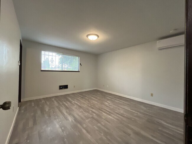 Building Photo - Single-Level 3-Bedroom Home with 2-Car Garage, Mini-Split AC, & Backyard Garden Space