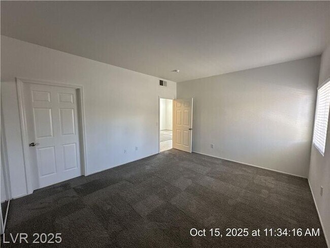 Building Photo - SPACIOUS FIRST-FLOOR CONDO LOCATED IN A GA...