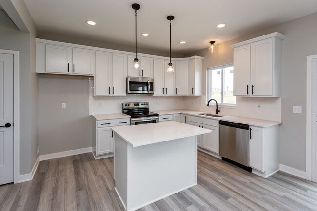 Building Photo - Spacious 4-Bedroom Home with 2-Car Garage & Yard