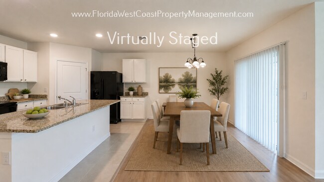 Building Photo - MOVE IN READY ! 4 BEDROOM/2 BATH! TILE- LVP THROUGHOUT! LAWN MOWING INCLUDED!