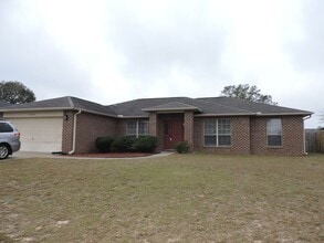 Building Photo - Four bedroom home near Whiting Field!