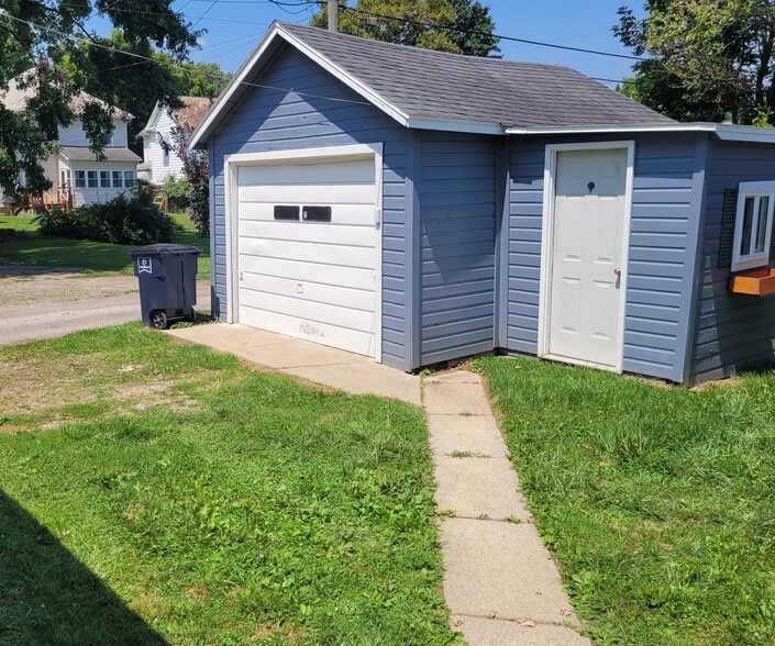 1 car garage right off the alley beside the house. - 711 E 6th Ave