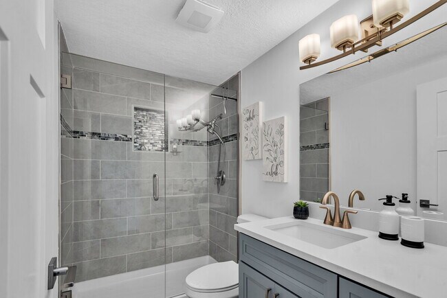 Building Photo - A spacious 3-bedroom, 2-bath layout provides plenty of room for family and guests!