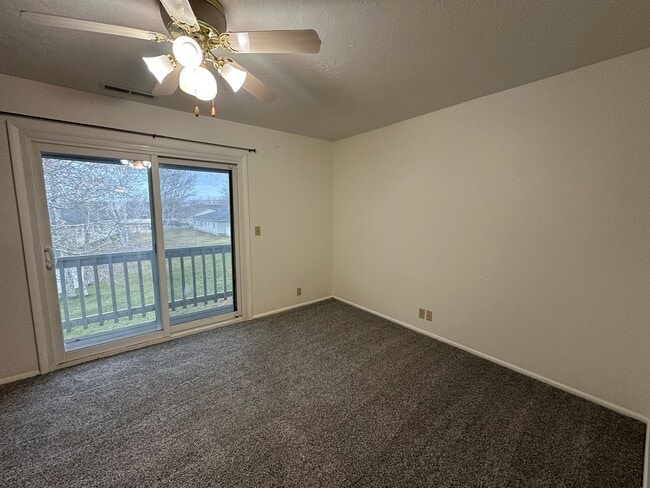 Building Photo - Spacious, three level, 4 Bed 2.5 bath Townhome in Ammon right behind the Walmart on Hitt.