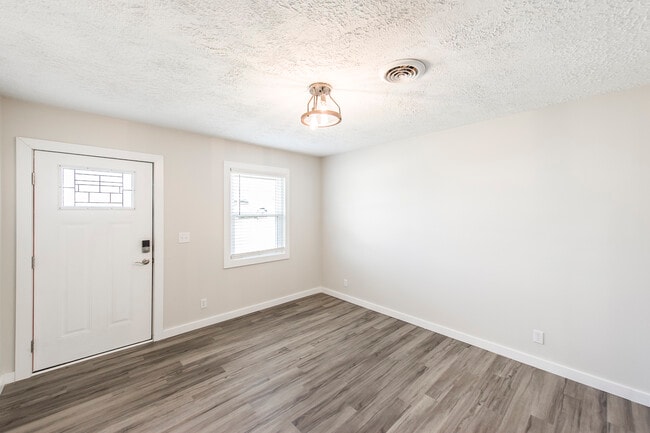 Living room view toward front door - 163 Drivers Ln