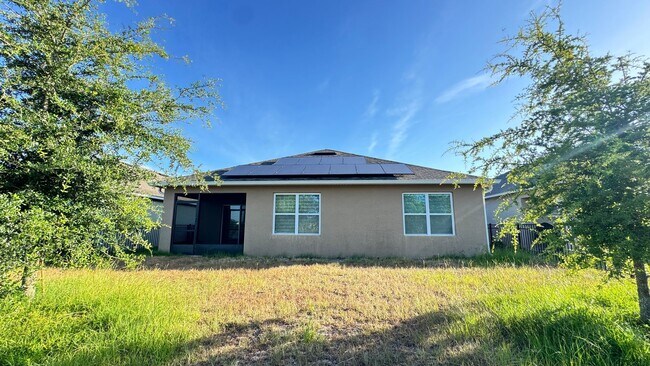 Building Photo - Available NOW! Spacious 4BD/2BA Haven in Villages at Harmony – Your Dream Home Awaits! WASHER & D...
