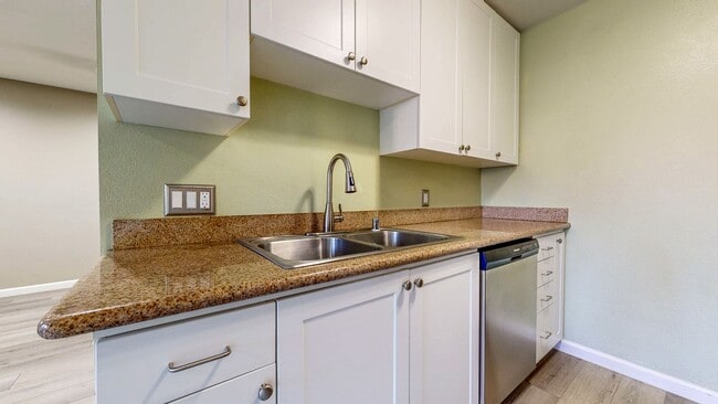Building Photo - Cozy 1 bedroom 1 bath end unit condo with 1 car garage and private patio located next to Peterson...
