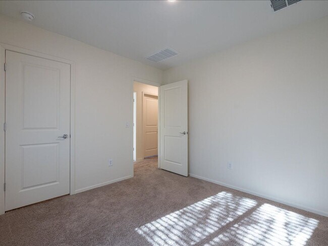 Building Photo - Spacious 4-Bedroom Home with Open Layout & Turf Backyard