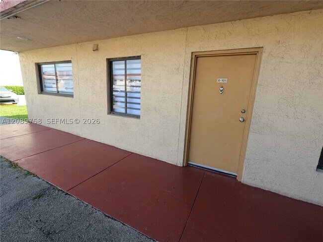 Building Photo - 9911 W Okeechobee Rd