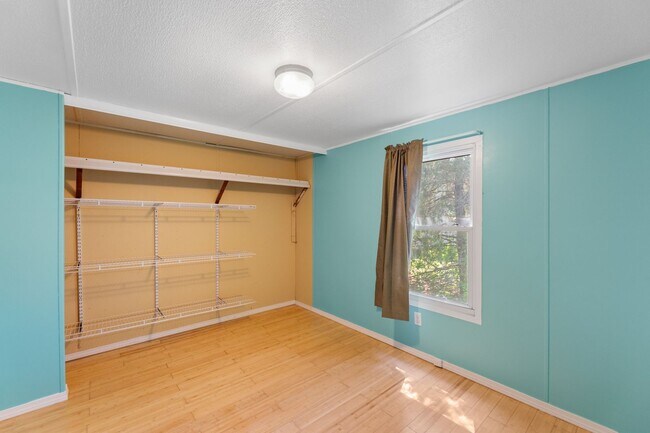 Building Photo - Updated mobile home on acre lot with garag...