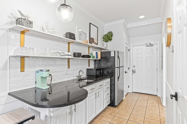 Building Photo - Available now.  Cute Furnished Studio Cond...