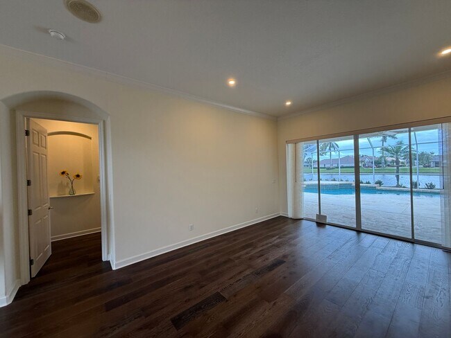 Building Photo - Luxurious 4 Bedroom 3 Bath Lakefront Pool Home W/3-Car Garage