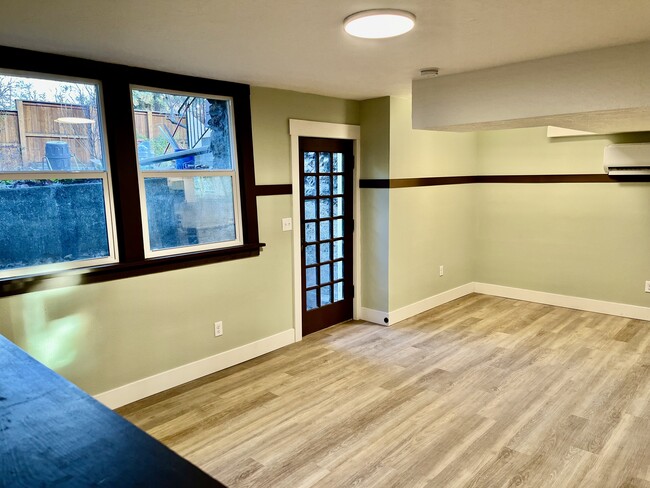 Entry way and dining area from (decorative) fireplace. - 1401 W 13th Ave