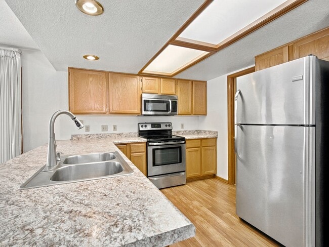 Building Photo - Spacious 2BR Rental with Open Floor Plan & Low-Maintenance yard